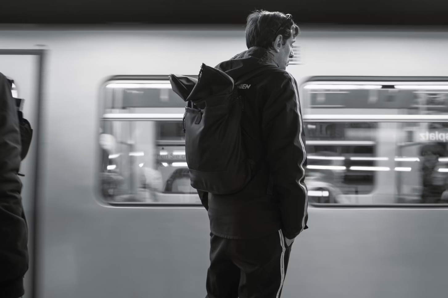 A woman on a train, lost in thought